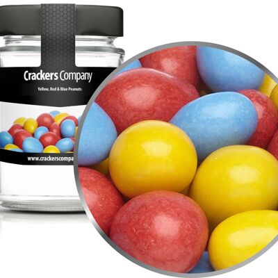 Cacahuètes colorées en chocolat, cacahuètes jaunes, rouges et bleues PU de 45 pièces. toi. Contenu de 110 g par pièce.