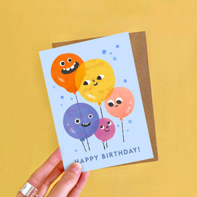 Biglietto d'auguri con facce di palloncini