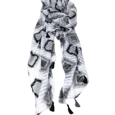 Scarf with geometric patterns and pompoms