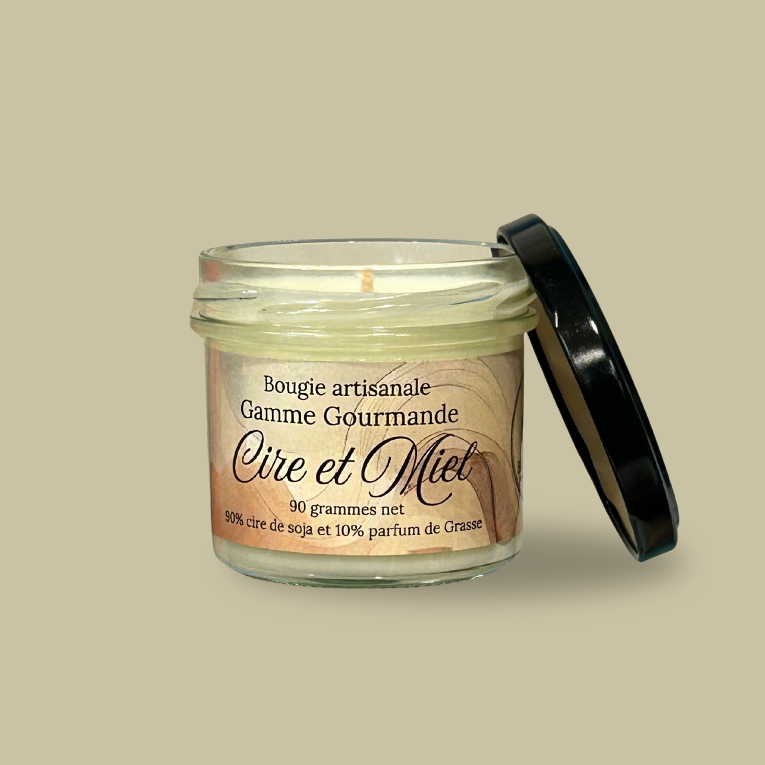 Vela hecha a mano con cera y aroma a miel.