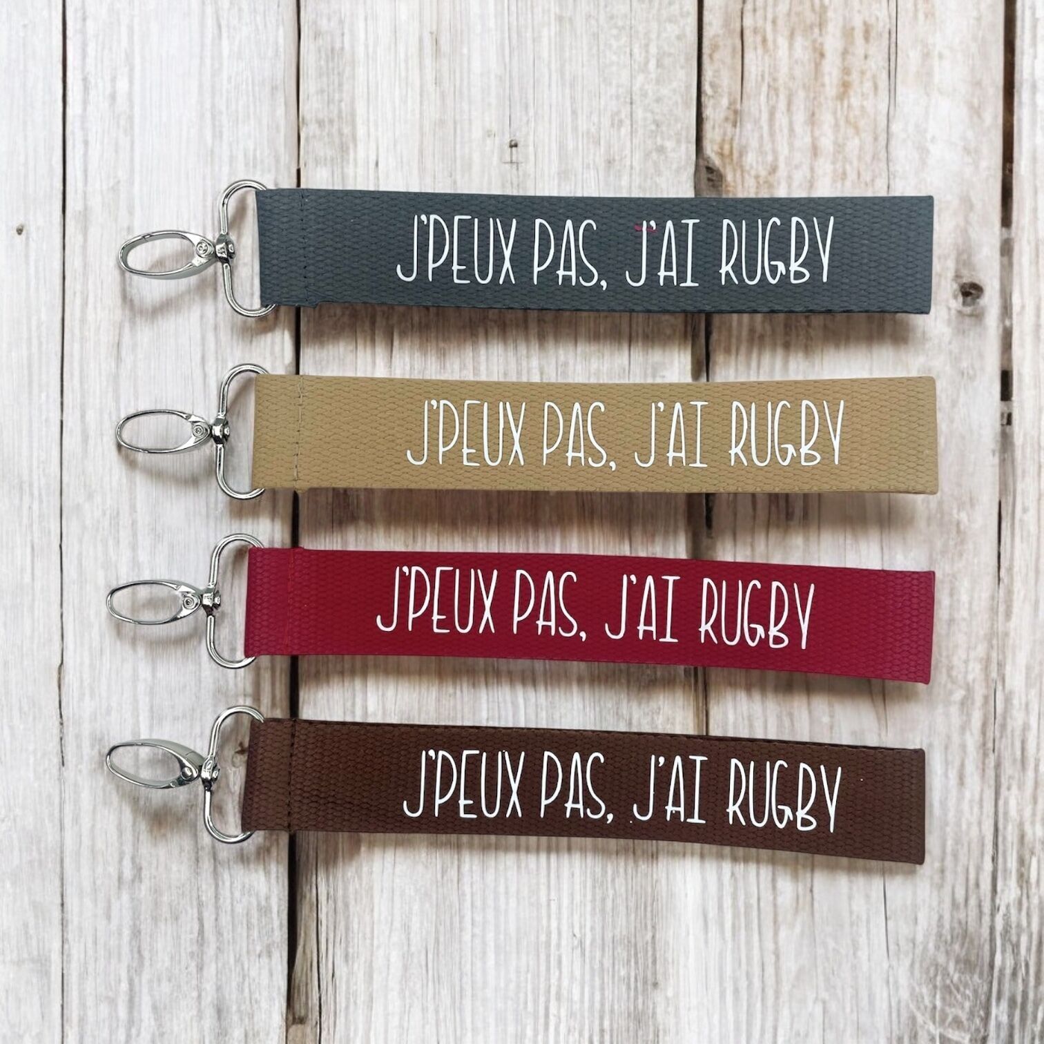 Schlüsselanhänger mit der Aufschrift: „Ich kann nicht, ich spiele Rugby.“