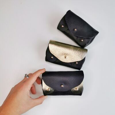 Trio of black and gold wallets