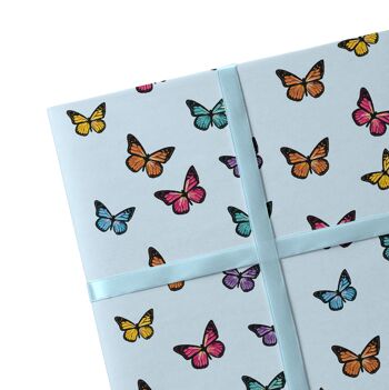 2 feuilles de papier cadeau papillon bleu 1