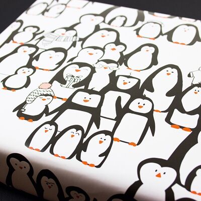 Desfile de pingüinos de papel de envolver