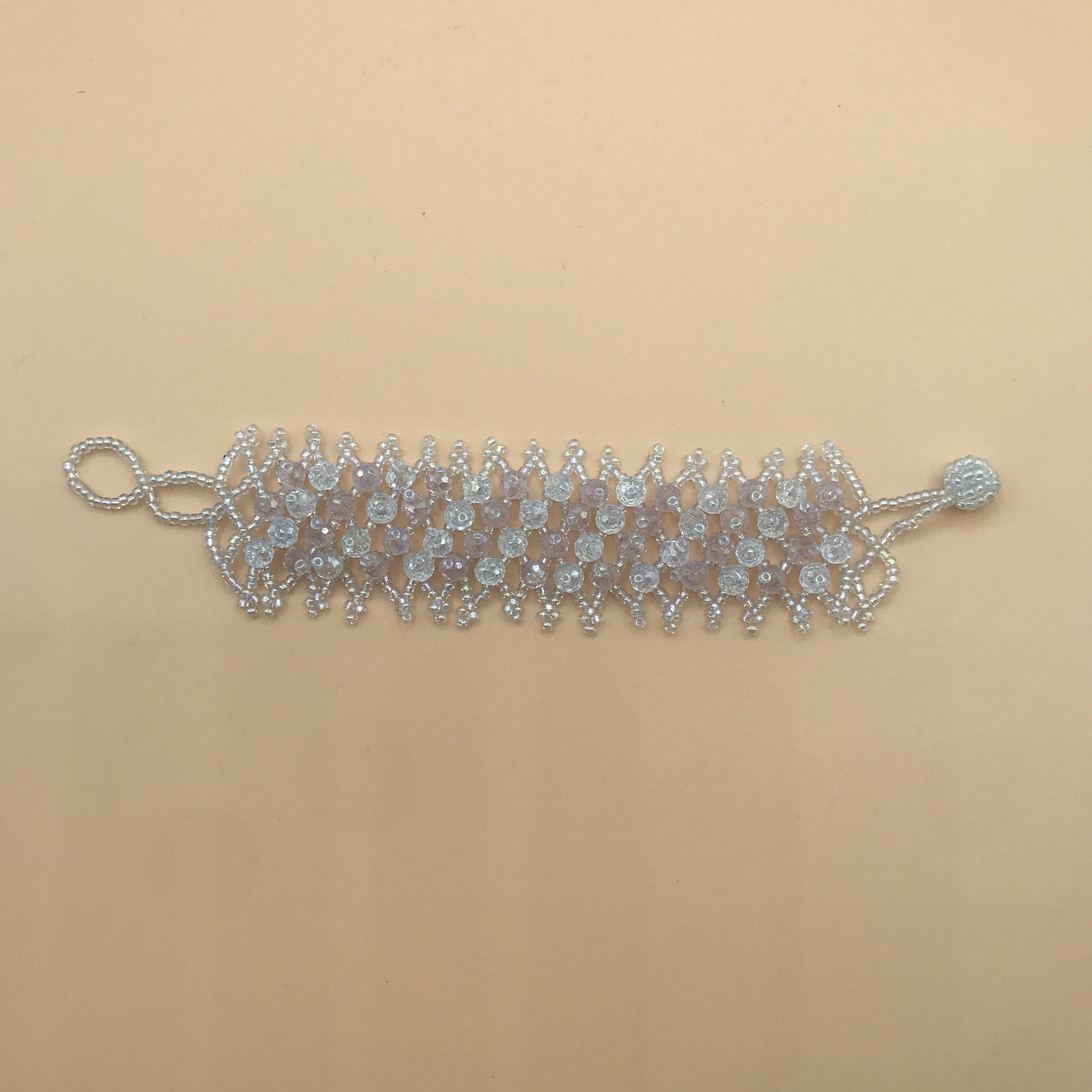 Bracciale con perline di ghiaia colorate - Rosa