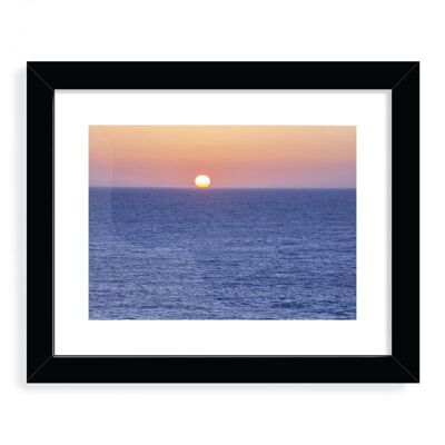 Sun setting in the ocean Designer Framed Art Print