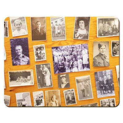An assortment of old family photos on a placemat