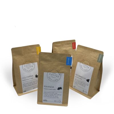Package with 4x250g freshly roasted coffee. Medium roasted coffee beans from Colombia & Rwanda. Light roasted coffee beans from Tanzania & Nicaragua. Whole beans