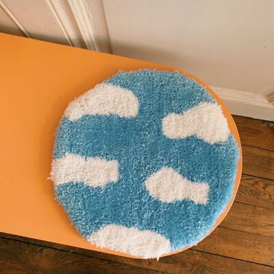 Round light blue cloud rug