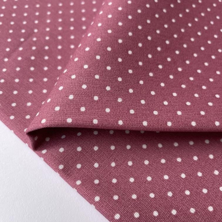 Tessuto popeline rosa a pois