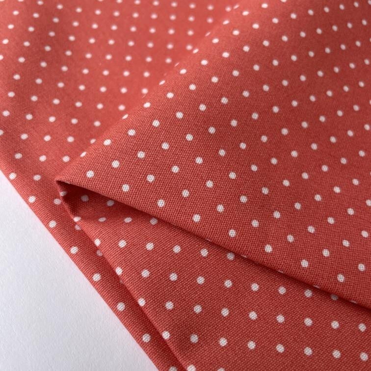 Tessuto popeline corallo a pois