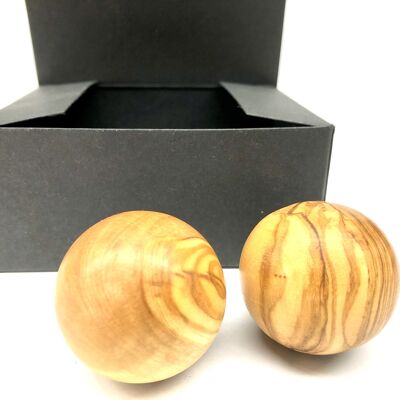 Relaxation balls made of olive wood in a box