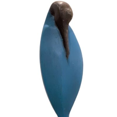 Bronzen vogel in blauw