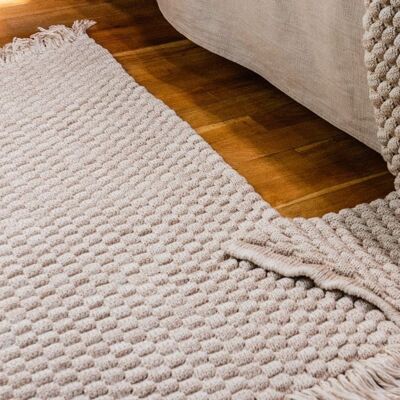 Beige knitted rug