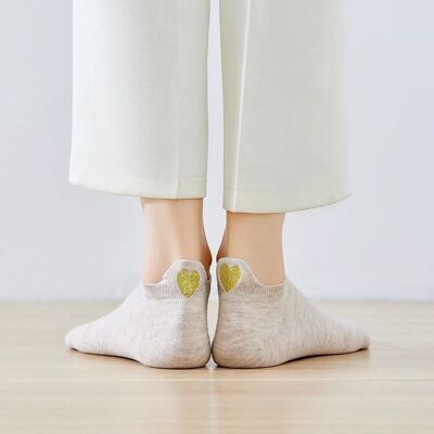 Calcetines con lengua de corazón dorado