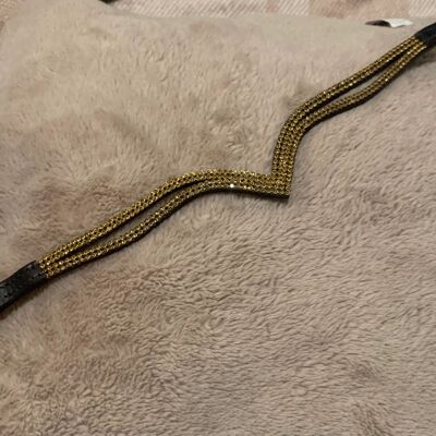Gold browband on brown leather. Full size