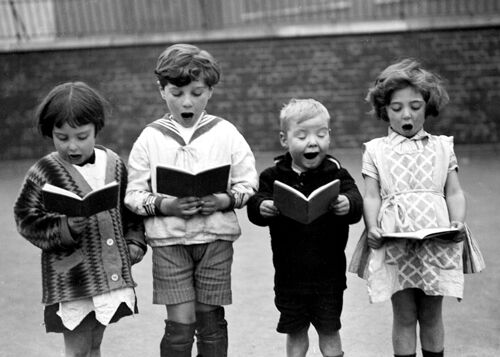 Children singing in the schoolyard blank greetings card
