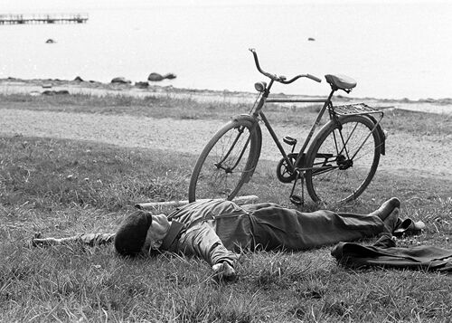 Man sleeping beside bike blank greetings card