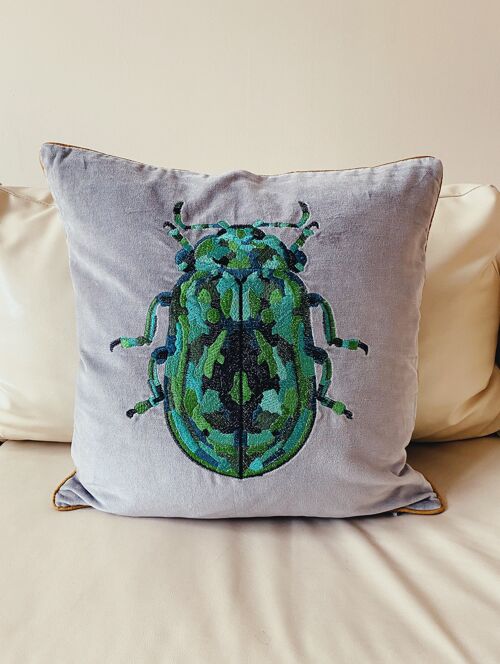 Jewelled beetle pale grey cushion
