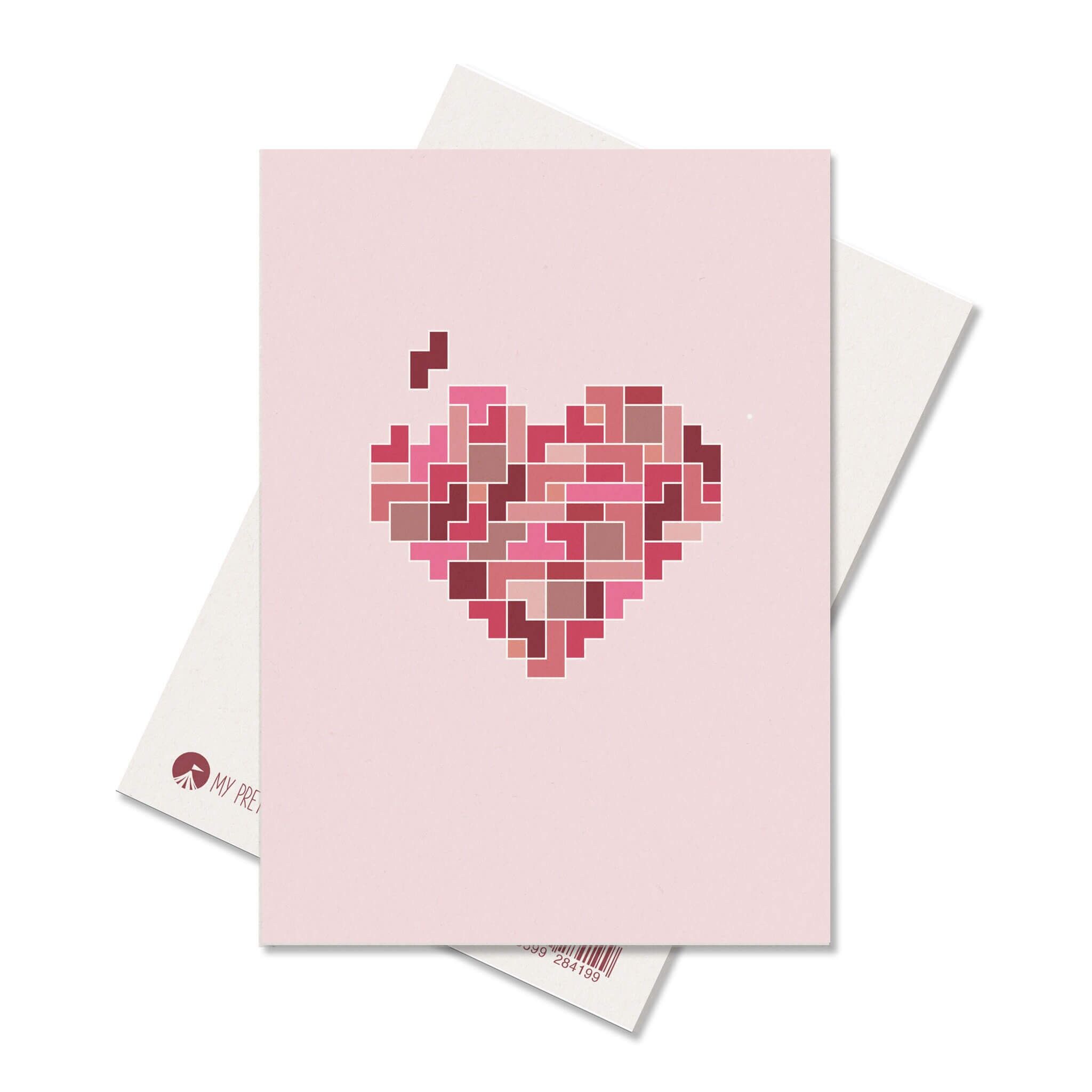 Postcard with a heart puzzle in pink red as a card for an anniversary, Mother's Day, a wedding or as a love message for Valentine's Day, heart card love