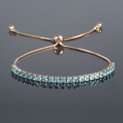 Verstellbares Goldarmband für Damen mit hellblauen Steinen