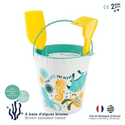 Ocean beach toy made from algae (bucket, shovel, sieve and rake)