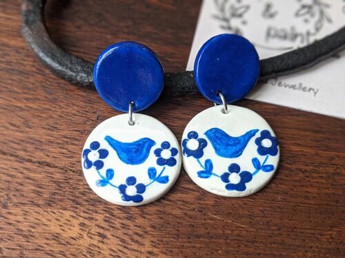 Blue and white earrings with hand drawn birds