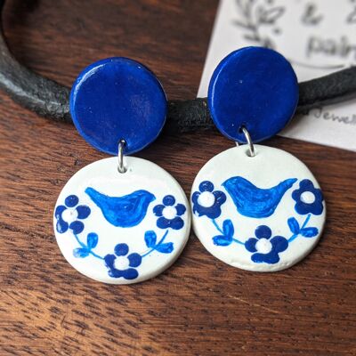 Blue and white earrings with hand drawn birds