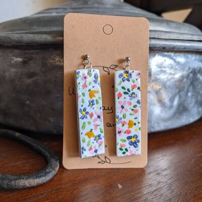 Delicate clay earrings with hand painted flowers