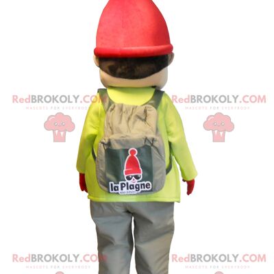 Little boy REDBROKOLY mascot dressed in ski outfit