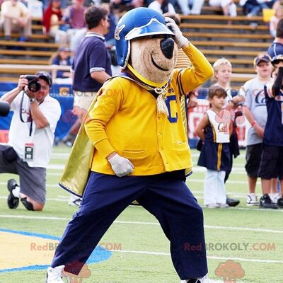 Brown bear REDBROKOLY mascot in yellow and blue outfit