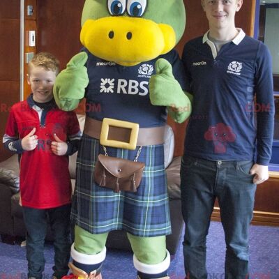 Green and yellow bird REDBROKOLY mascot dressed in Scottish