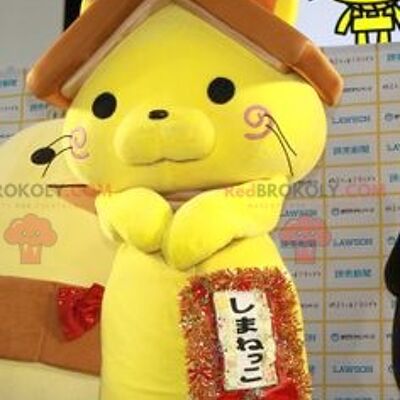 Yellow cat REDBROKOLY mascot with a house roof on the head