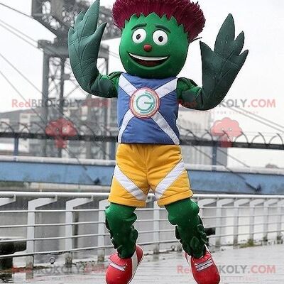 Green and red artichoke REDBROKOLY mascot in blue and yellow outfit