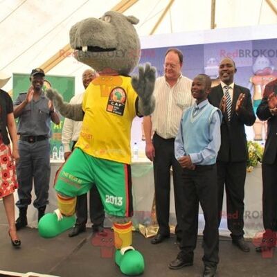 Gray hippopotamus REDBROKOLY mascot in yellow and green outfit