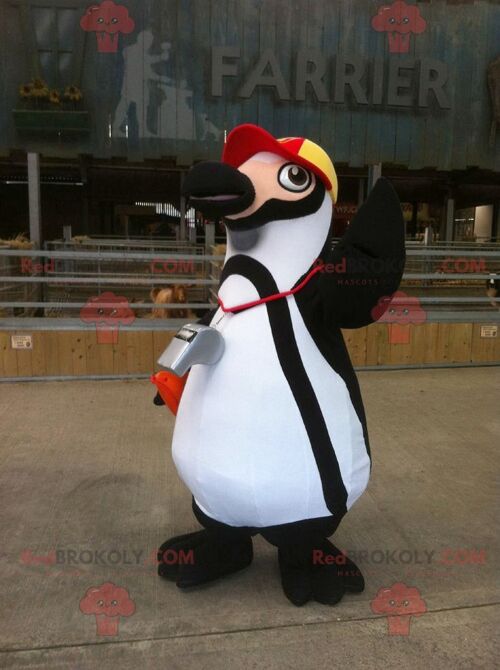 Black and white penguin REDBROKOLY mascot with a cap , REDBROKO__0404
