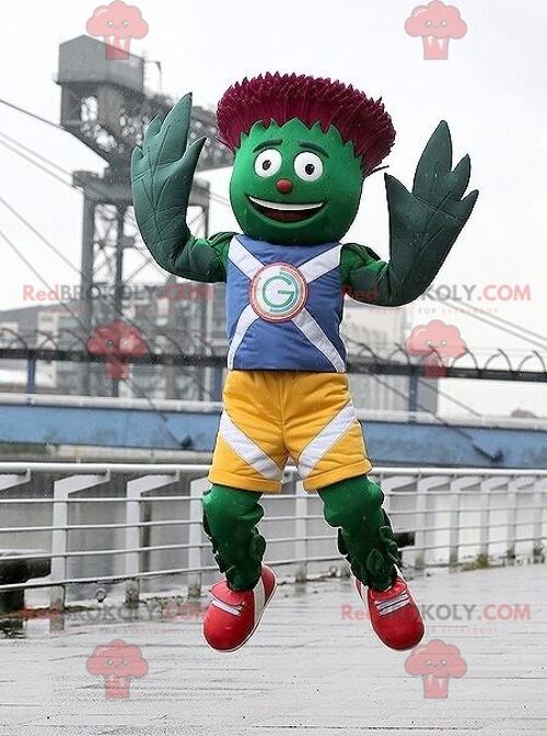 Green and red artichoke REDBROKOLY mascot in blue and yellow outfit , REDBROKO__0656
