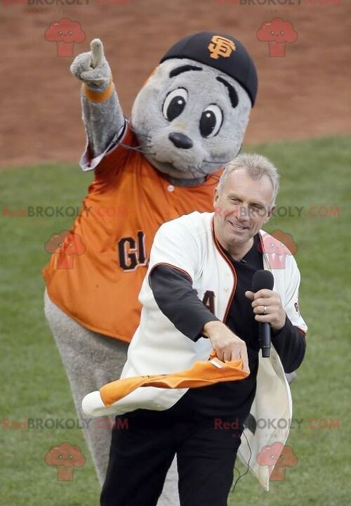 Gray sea lion REDBROKOLY mascot with an orange t-shirt , REDBROKO__0863