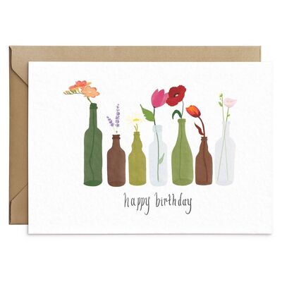 Tarjeta de cumpleaños con botella de flores silvestres