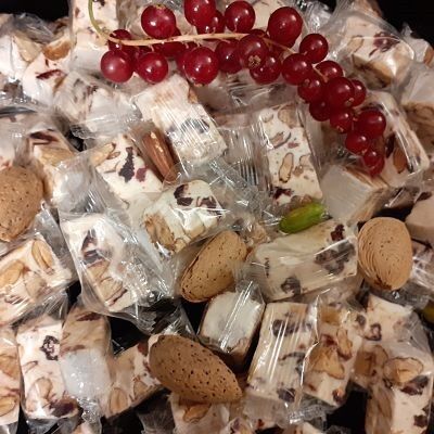 Bulk of soft white nougat from Provenceaux Cranberries domino individually wrapped