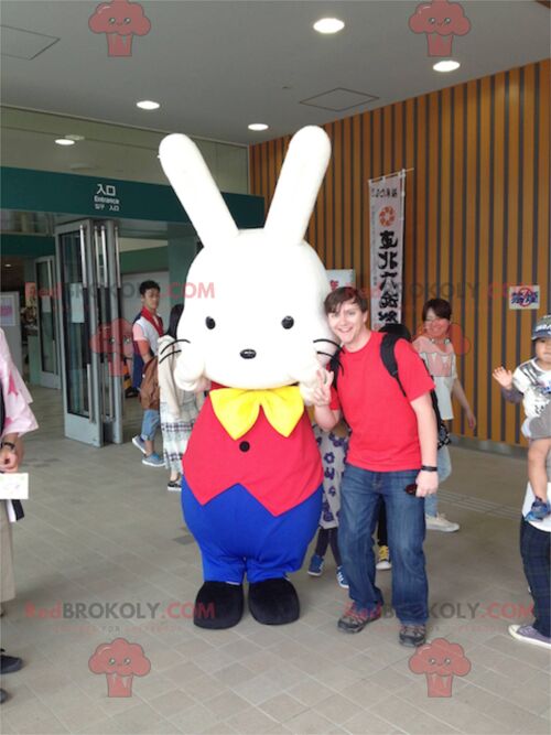 White rabbit REDBROKOLY mascot in red and blue outfit / REDBROKO_02362