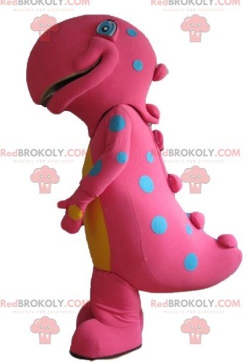Pink and yellow dinosaur REDBROKOLY mascot smiling and colorful / REDBROKO_02829