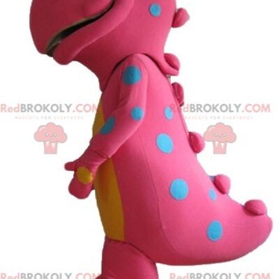 Rosa und gelber Dinosaurier REDBROKOLY Maskottchen lächelnd und bunt / REDBROKO_02829