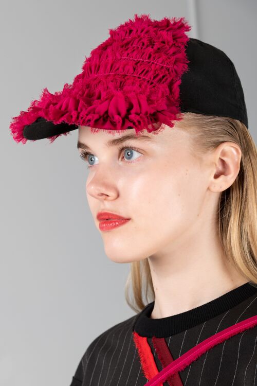 Asclepius black cap with red ruffles
