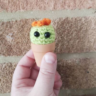 Tiny Chloe crochet cactus with an orange flower in a terracotta pot