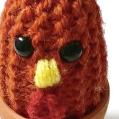 Knitted chicken plushie ideal for your kitchen windowsill, sits in a real terracotta pot.