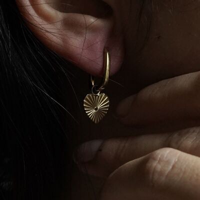 Engraved radiant heart golden steel earrings