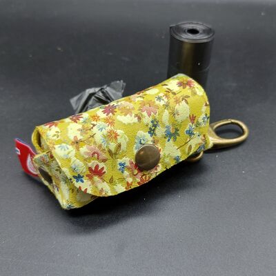 Dog bag holder handcrafted in 1.3mm thick natural leather printed with flowers. Opplav doggyflowers.(Yellow color)