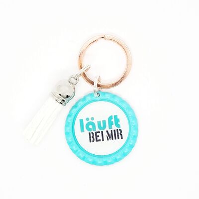 Key ring in a bottle cap - saying runs with me - pendant tassel