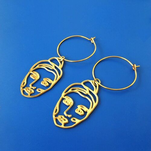 Women golden earrings hoops